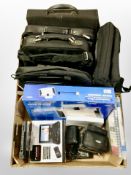 Two boxes of laptop bags, boxed paper trimmer, portable DVD player,