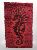 A continental wool wall hanging depicting a seahorse,