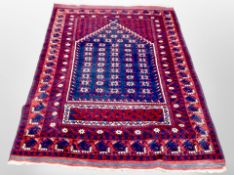 An Afghan Balouch prayer rug on indigo ground,