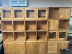 A late 20th century Scandinavian pine effect modular bookcase system,