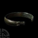 Viking Age Bronze Stamped Bracelet with Beast Head Terminals