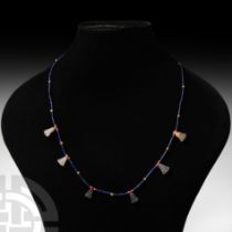 Egyptian Lapis Lazuli Necklace with Papyrus Flower Amulets