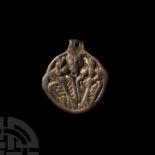 Viking Silver-Gilt Pendant with Odin Gripping Two Ravens