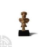 Western Asiatic Terracotta Seated Male Figure Holding an Axe