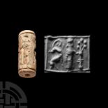 Western Asiatic Glazed Composition Cylinder Seal with Quadrupeds
