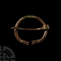 Viking Age Bronze Torc-Shaped Brooch with Beast Heads