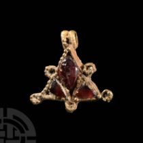 Medieval Triangular Gold Pendant with Garnets