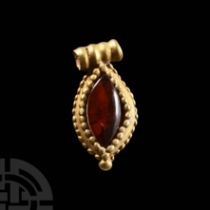 Medieval Gold Bifacial Pendant with Garnet