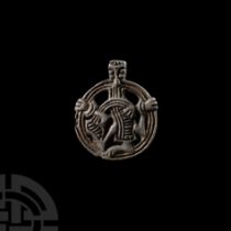 Viking Age Silver Pendant with Gripping Beast