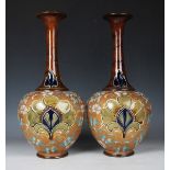 A large pair of Royal Doulton Slaters Patent stoneware bottle vases, early 20th century, the bulbous