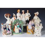 A collection of Staffordshire pottery figures, 19th century, including Romeo and Juliet seated