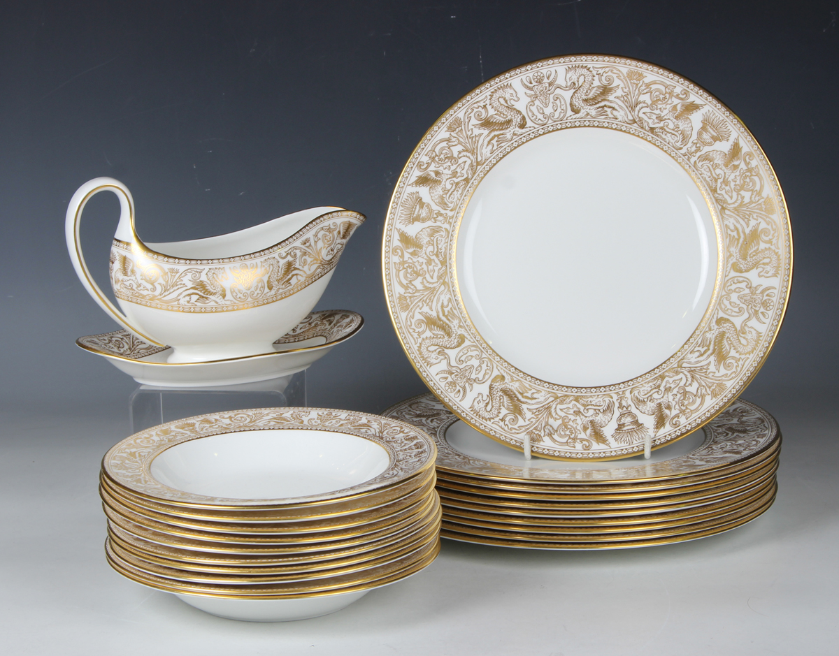 A Wedgwood Gold Florentine pattern part service, comprising ten dinner plates, diameter 27.3cm, nine