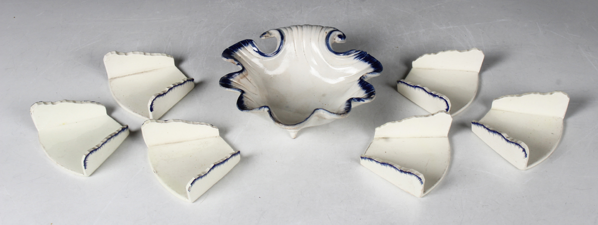 Six creamware asparagus servers, circa 1790, of traditional fan shape with feather edge rims