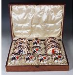 A set of six Royal Crown Derby coffee cups and saucers, circa 1905-06, decorated with Imari