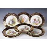 A cased set of twelve Sèvres style French porcelain plates, late 19th/early 20th century, each