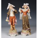 A pair of Royal Dux figures, early 20th century, modelled as a lady and gentleman in period dress,