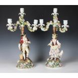 A pair of Sitzendorf figural four-light candelabra, late 19th century, modelled as a lady with a