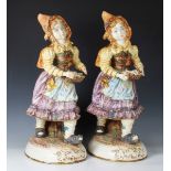 Two large Capodimonte child lampbase figures, 20th century, both street urchins carrying a basket of
