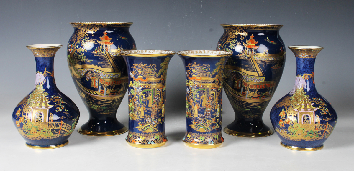 Three pairs of blue ground Carlton Ware vases, first half 20th century, comprising a cylindrical