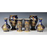 Three pairs of blue ground Carlton Ware vases, first half 20th century, comprising a cylindrical