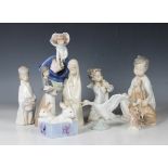Eight Lladro porcelain figures, including Pretty Pickings, No. 5222, height 17.5cm, Boy with Dog,