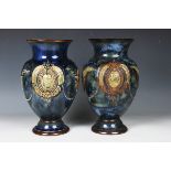A pair of Royal Doulton stoneware vases, early 20th century, relief decorated with a portrait of a