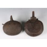 Two early 20th century Middle Eastern wrought metal and embossed stitched leather powder flasks,