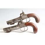 A pair of early 19th century percussion pistols by Richard Hollis, London, each with turn-off
