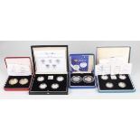 A collection of Royal Mint silver piedfort coins, including a 1984-1987 one pound four-coin set, a