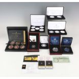 A large collection of modern commemorative coins and medallions, including a Jubilee Mint five