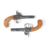 Two similar early 19th century percussion pistols by T. Fletcher, Gloucester, with turn-off barrels,