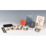 A small group of military-related items, including a Birmingham silver pillbox with RAF badge, a