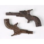 Two late 19th/early 20th century cast metal toy cap guns, one detailed 'Lion', length 13cm, the