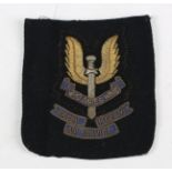 A mid-20th century Special Air Service Regiment embroidered bullion wire blazer badge.Buyer’s
