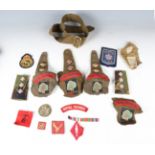 A large collection of 20th century military badges, buttons and other items, including a group of