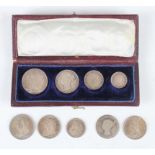 A Victoria Young Head four-coin Maundy set 1867, cased, together with four other Maundy coins,