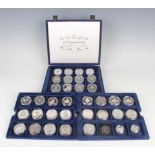 A collection of thirty-three Westminster Mint silver crown-size commemorative coins, together with