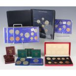 A George VI nine-coin specimen set 1950, within a red fitted case, together with three George V
