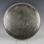 A late Victorian Aesthetic Movement circular plated salver, the centre engraved with birds,