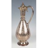 A Victorian Aesthetic silver ewer, the narrow tapering neck with hinged lid and knop finial above