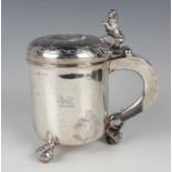 An 18th century silver peg tankard, probably Scandinavian, of cylindrical form, chased with three