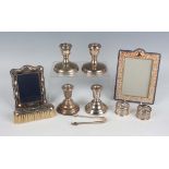 A group of silver items, including a pair of stub candlesticks, Birmingham 1975 and 1976 by