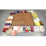A quantity of mixed textiles, including a Paisley silk shawl fragment, various printed panels and