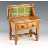 An Edwardian pine and walnut diminutive model of a dressing table with tiled back, height 34cm,