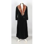 An early 20th century black velvet evening cloak by Dickens & Jones of London, with a brown fur