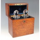 An early 20th century oak cased twin-bottle tantalus by Army & Navy, the interior fitted with two