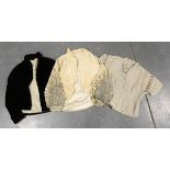 A collection of costume and accessories, including a cream velvet and bead appliqué jacket, a