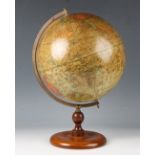 An early 20th century 'Geographia' 10-inch terrestrial table globe, on a turned elm base, height