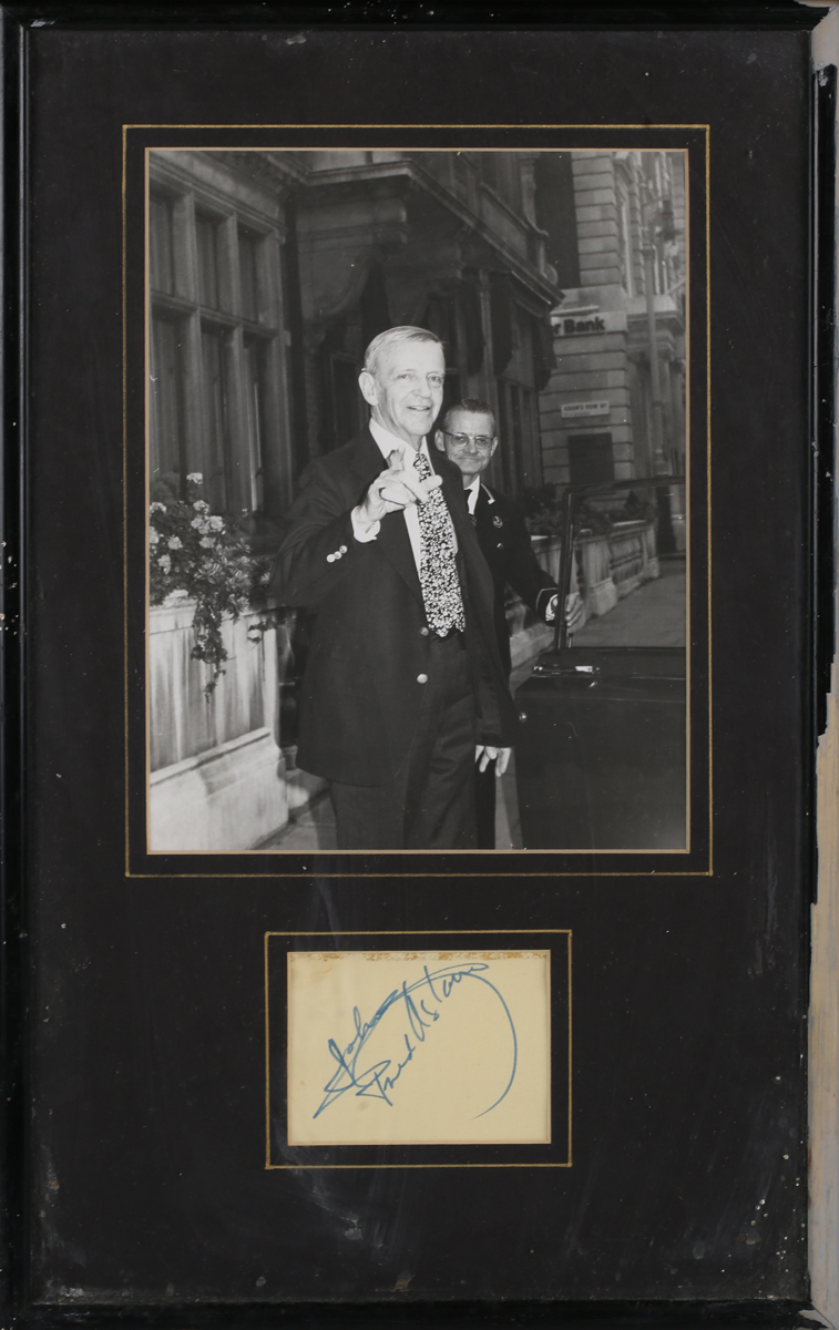 AUTOGRAPHS. An autographed leaf signed by Fred Astaire, mounted and framed with a black and white