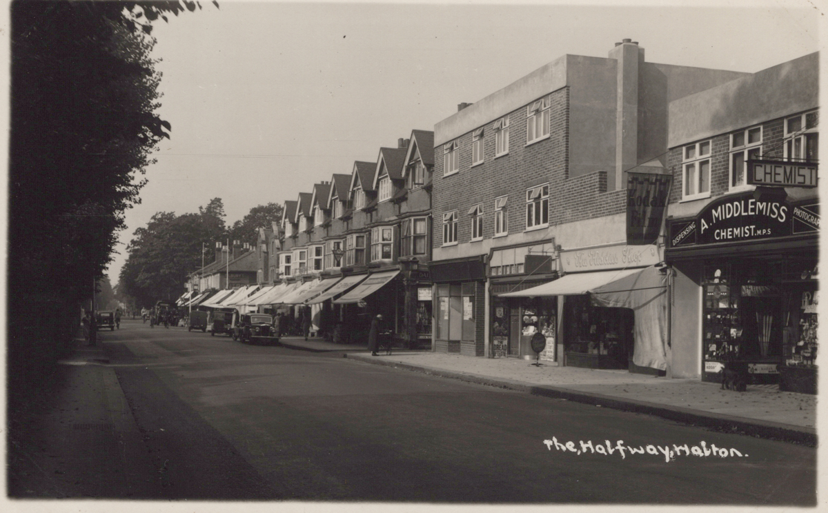 An album containing 39 postcards of Walton-on-Thames, including photographic postcards titled 'New